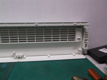 Front grill from a Sharper Image PORTAL Window Fan