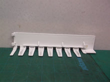 refrigerator ice maker cube ejector off a Kenmore 10673206300 Refrigerator