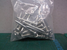 (25pcs) 2-1/4 x 3/16 nail type hex drive w nuts furniture assembly of some kind