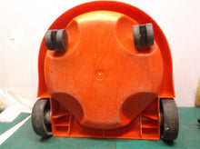 Red bucket with wheels from a henry vac nur200