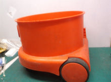 Red bucket with wheels from a henry vac nur200