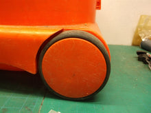 Red bucket with wheels from a henry vac nur200