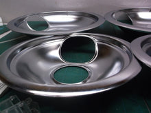 Set of 4 burner pans with large side hole