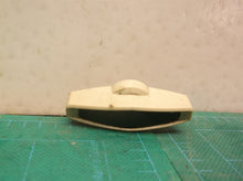 Side cover knob from a Off A Homelite UT43104 Electric Chain Saw