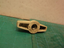 Side cover knob from a Off A Homelite UT43104 Electric Chain Saw
