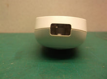 Button housing off a Calming Heat Massaging Weighted Heating Pad by Sharper Imag