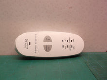 Button housing off a Calming Heat Massaging Weighted Heating Pad by Sharper Imag