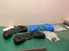 lot of 2 black controller and thumb stick covers and 1 blue controller and thums