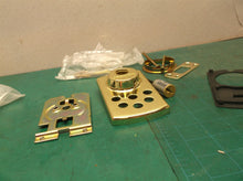 Assorted parts off a Kwikset 907 deadbolt