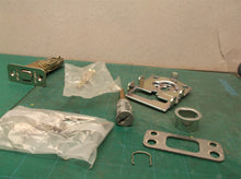 assorted parts off a Kwikset 888 deadbolt