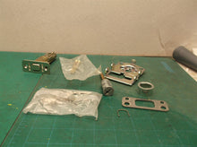 assorted parts off a Kwikset 888 deadbolt