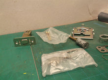 assorted parts off a Kwikset 888 deadbolt