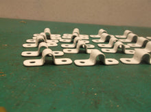 LOT OF 25 SADDLE CLAMPS NO HARDWARE