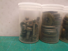 5 small jars of assorted clock parts