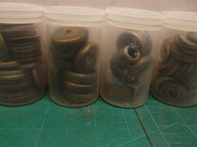 5 small jars of assorted clock parts