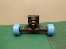 truck with wheels off a 31" hot wheels skateboard