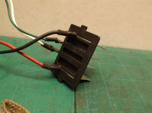 battery connector off a EGO POWER+ ST1511T POWERLOAD 56-volt 15-in Cordless Stri