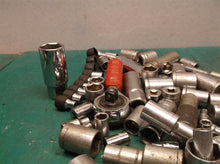 misc. Sockets off a 1/4 and 3/8ths bit set with ampro professional ratchet