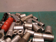 misc. Sockets off a 1/4 and 3/8ths bit set with ampro professional ratchet