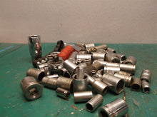 misc. Sockets off a 1/4 and 3/8ths bit set with ampro professional ratchet