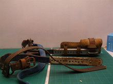 Set of 2 pole climbing spikes missing one strap