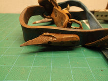 Set of 2 pole climbing spikes missing one strap