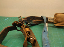 Set of 2 pole climbing spikes missing one strap