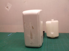 Tank and housing from an unbranded soap/sanitizer dispenser
