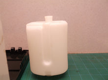 Tank and housing from an unbranded soap/sanitizer dispenser