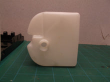 Tank and housing from an unbranded soap/sanitizer dispenser