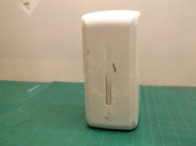 Tank and housing from an unbranded soap/sanitizer dispenser