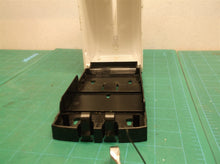Tank and housing from an unbranded soap/sanitizer dispenser