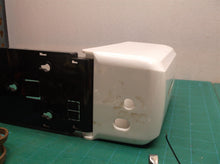 Tank and housing from an unbranded soap/sanitizer dispenser