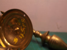 2 brass colored wall mount candle holder