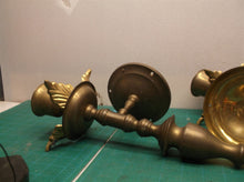 2 brass colored wall mount candle holder