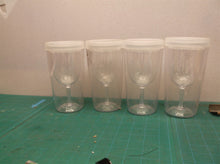 Set of 4 plastic cups with lids that look like wine glasses