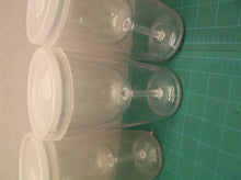 Set of 4 plastic cups with lids that look like wine glasses