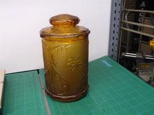 9" tall brown glass jar with lid