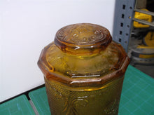 9" tall brown glass jar with lid