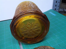 9" tall brown glass jar with lid