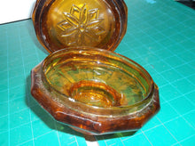9" tall brown glass jar with lid