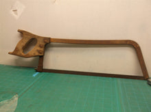 vintage hack saw with wooden handle