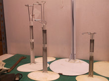 lot of 6 doll stands 2 large base & 4 smaller oval bases