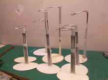 lot of 8 doll stands 2 large base & 4 smaller oval bases