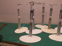 lot of 7 doll stands 6 oval base & 1 round base
