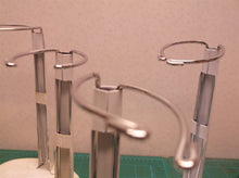 lot of 7 doll stands 6 oval base & 1 round base