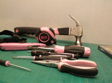 pink tool bag with assorted pink tools