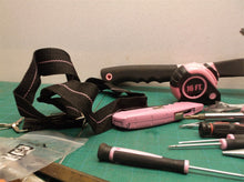 pink tool bag with assorted pink tools