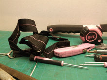 pink tool bag with assorted pink tools