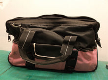 pink tool bag with assorted pink tools